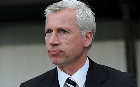 Alan Pardew looks on from the dug-out at St.James' Park