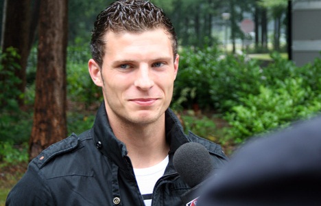 Erik Pieters smirks during a interview with the media