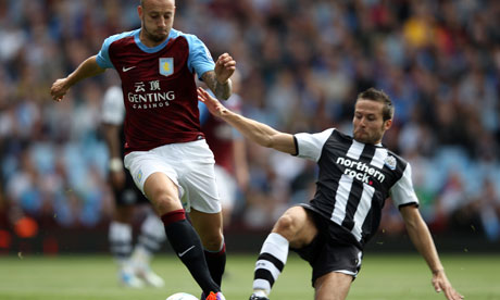 Yohan Cabaye makes a tackle on Aston Villa's Alan Hutton in the Premier League