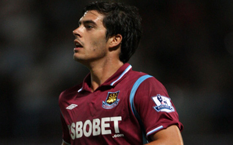 James Tomkins in action for West Ham at Upton Park against Arsenal