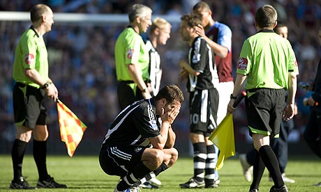 Steven Taylor heartbroken on the pitch at Villa Park following relegation