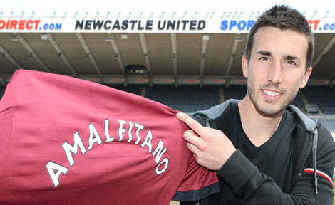 Romain Amalfitano holds a Newcastle United jersey at St.James' Park