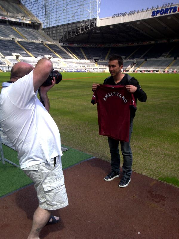 Romain Amalfitano holds a Newcastle United jersey