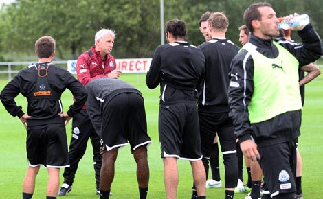 Xisco takes a drink at a Newcastle United training session