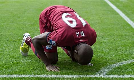 Demba Ba celebrates after scoring his second goal against Reading