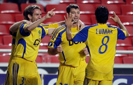 Metalist celebrate after scoring against Manchester City