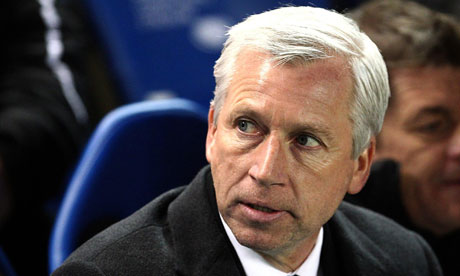 Alan Pardew looks on during a Premier League game