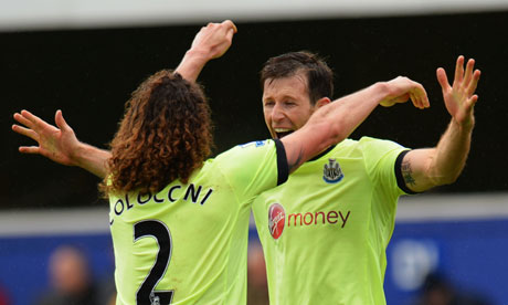 Fabricio Coloccini and Mike Williamson celebrate at Loftus Road