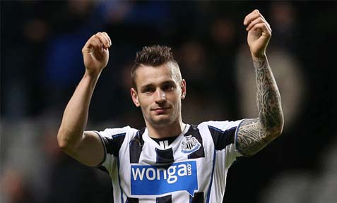 Mathieu Debuchy salutes in Newcastle United supporters