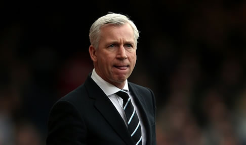 Alan Pardew watches his side take on West Ham United