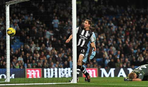 Dan Gosling scores against Manchester City in the Premier League