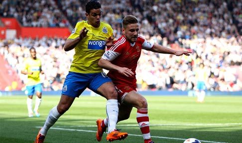 Hatem Ben Arfa tussles for posession with Luke Shaw of Southampton