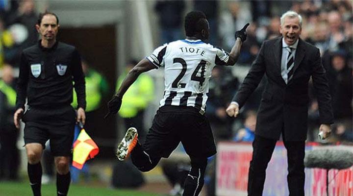 Cheick Tioté celebrates by sprinting to the substitutes bench