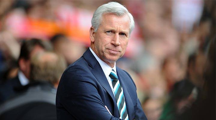 "Alan Pardew watches on from the Newcastle United sideline"