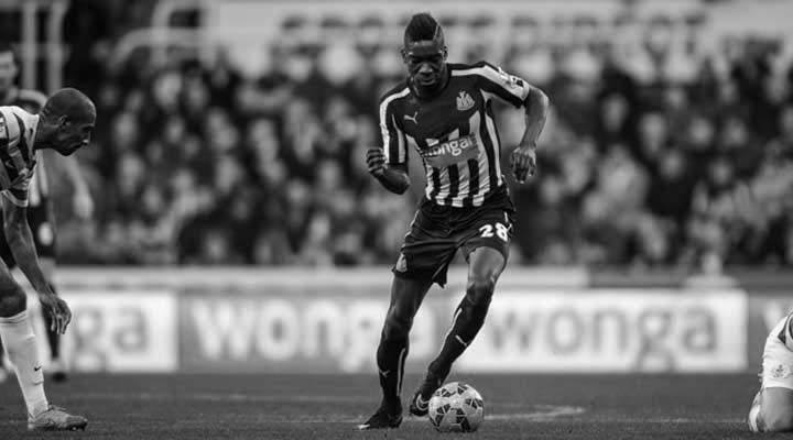 Sammy Ameobi takes on Karl Henry of QPR